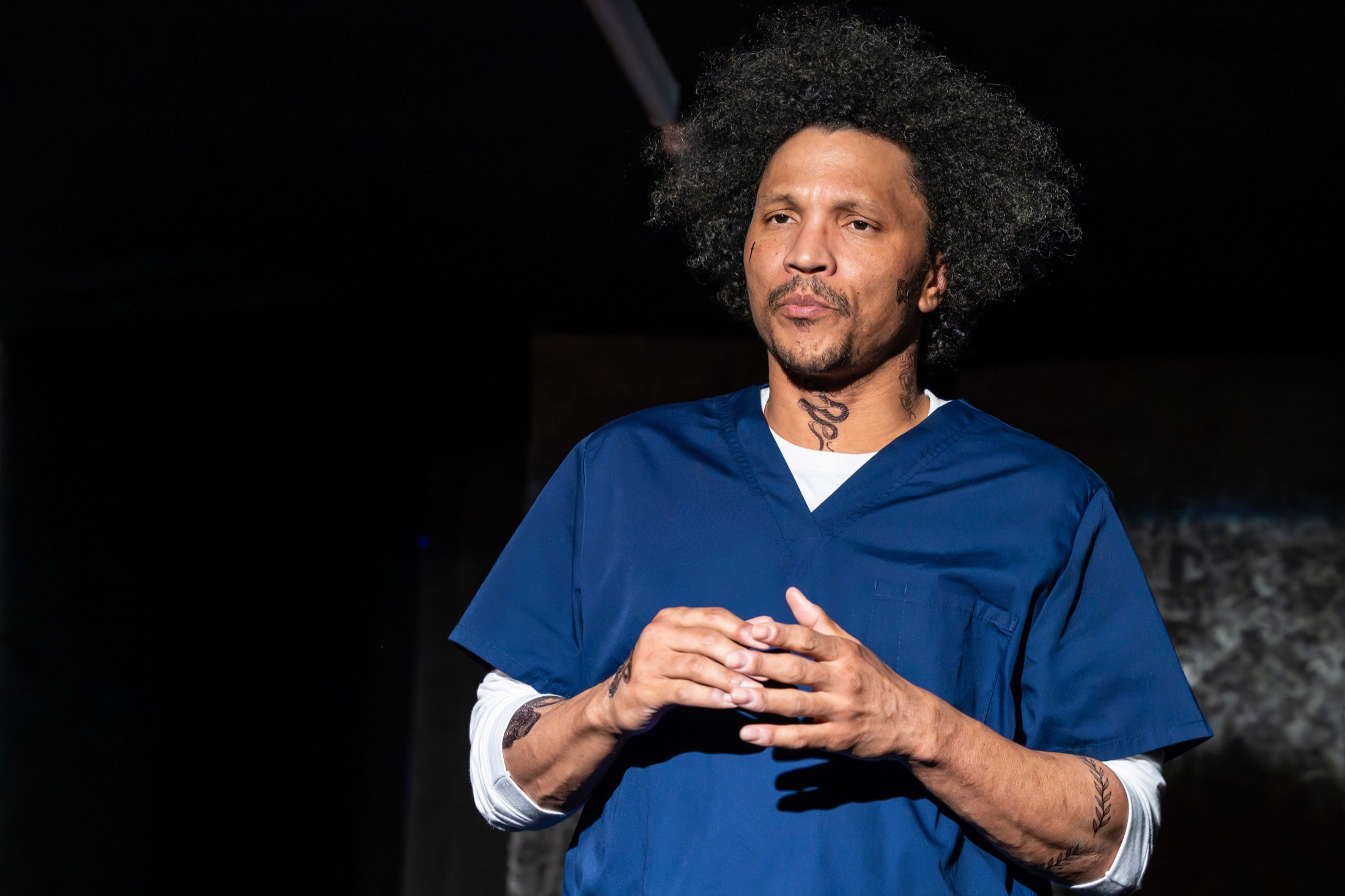 An Inside Out performer gestures onstage