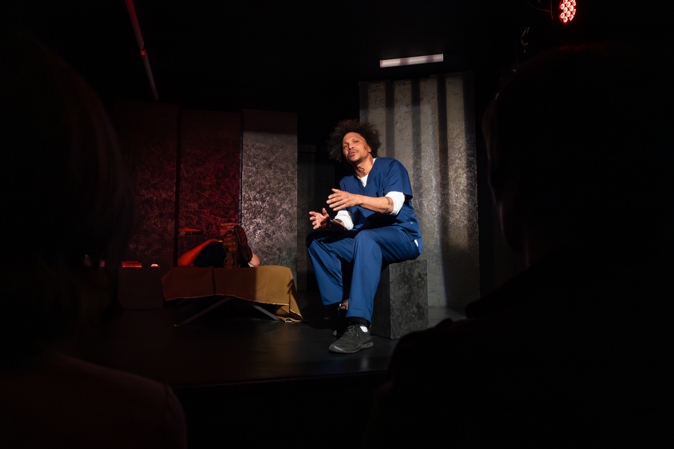 An Inside Out performer speaking on The Invisible Theatre stage